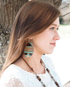 Woman wearing Leather Oval Earrings in Turquoise Navajo