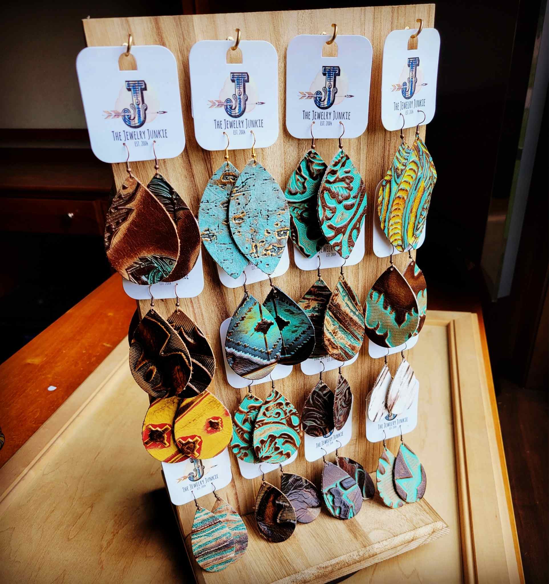 Embossed Leather Earring With Wood Rotating Display