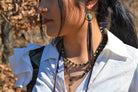 A Girl Wearing Turquoise Drop Earrings w/ Brown Leather Tassel