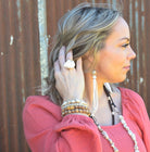 Girl Wearing Turquoise Drop Earrings w/ Leather Tassel-Cream