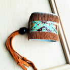 A women's leather cuff bracelet from The Jewelry Junkie.