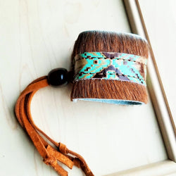 A women's leather cuff bracelet from The Jewelry Junkie.