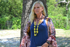 Women Wearing Double Strand Lariat in Frosted Blue Lapis with Copper Feather